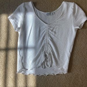 Very cute white hollister top with ruching down the middle